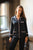 Hera Womens Black Satin Pajamas - Model Lifestyle | Bown of London